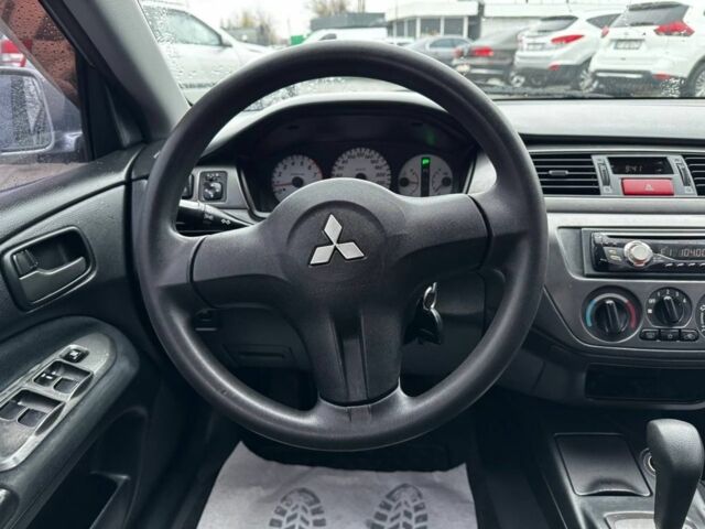 Серый Мицубиси Лансер, объемом двигателя 1.6 л и пробегом 205 тыс. км за 5300 $, фото 9 на Automoto.ua