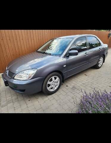 Сірий Міцубісі Lancer, об'ємом двигуна 1.6 л та пробігом 174 тис. км за 5850 $, фото 8 на Automoto.ua
