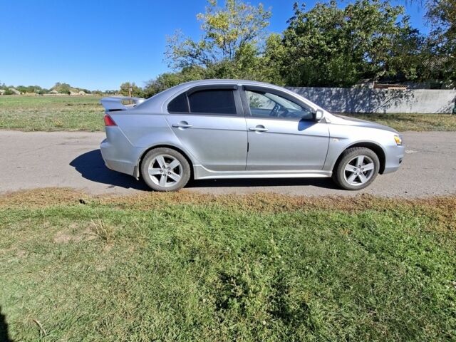 Серый Мицубиси Лансер, объемом двигателя 2 л и пробегом 224 тыс. км за 5500 $, фото 2 на Automoto.ua