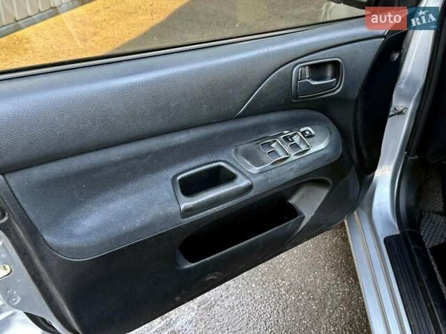 Сірий Міцубісі Lancer, об'ємом двигуна 1.6 л та пробігом 395 тис. км за 4900 $, фото 14 на Automoto.ua