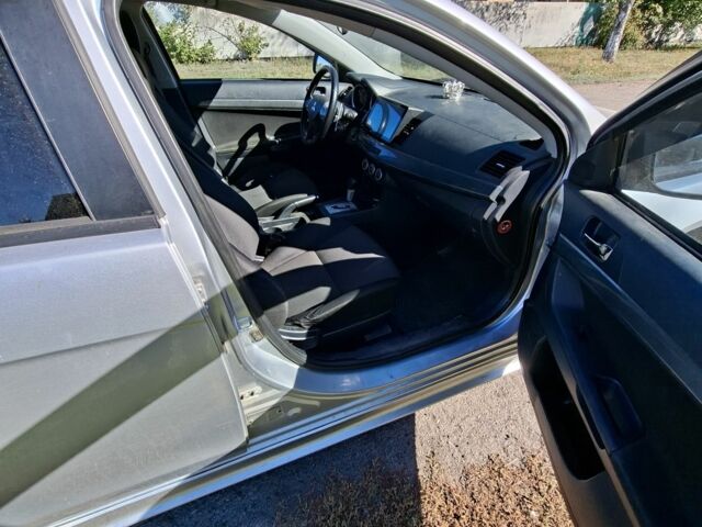 Серый Мицубиси Лансер, объемом двигателя 2 л и пробегом 224 тыс. км за 5500 $, фото 7 на Automoto.ua