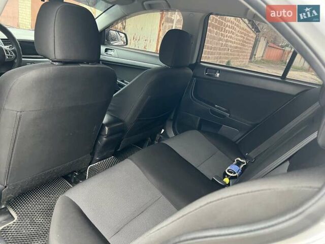 Серый Мицубиси Лансер, объемом двигателя 2 л и пробегом 180 тыс. км за 6799 $, фото 8 на Automoto.ua