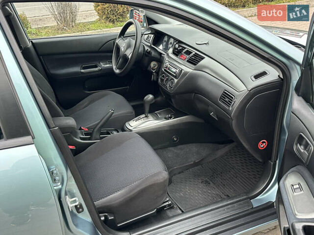 Сірий Міцубісі Lancer, об'ємом двигуна 1.6 л та пробігом 116 тис. км за 5199 $, фото 32 на Automoto.ua
