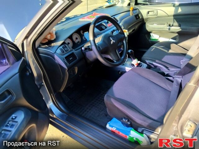 Серый Мицубиси Лансер, объемом двигателя 1.6 л и пробегом 190 тыс. км за 4200 $, фото 5 на Automoto.ua