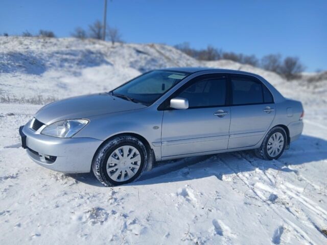 Серый Мицубиси Лансер, объемом двигателя 1.6 л и пробегом 277 тыс. км за 4599 $, фото 4 на Automoto.ua