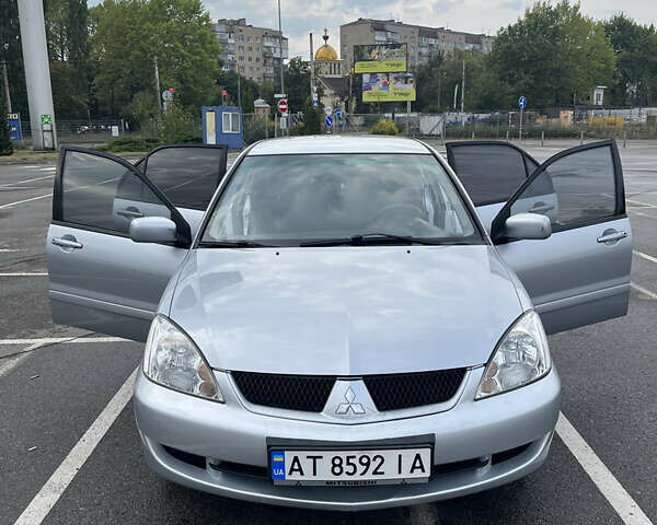 Серый Мицубиси Лансер, объемом двигателя 1.58 л и пробегом 232 тыс. км за 4900 $, фото 2 на Automoto.ua