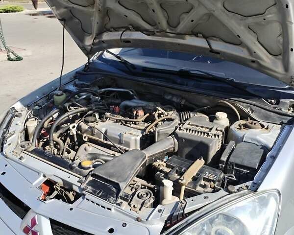 Серый Мицубиси Лансер, объемом двигателя 1.6 л и пробегом 210 тыс. км за 3500 $, фото 13 на Automoto.ua