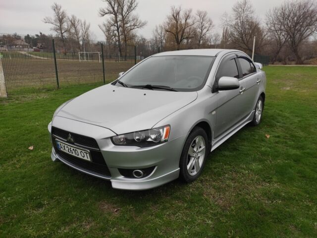 Серый Мицубиси Лансер, объемом двигателя 2 л и пробегом 124 тыс. км за 7499 $, фото 2 на Automoto.ua