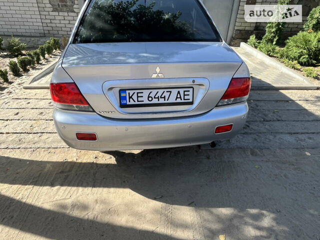 Сірий Міцубісі Lancer, об'ємом двигуна 1.58 л та пробігом 212 тис. км за 5600 $, фото 3 на Automoto.ua