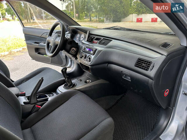 Сірий Міцубісі Lancer, об'ємом двигуна 1.58 л та пробігом 181 тис. км за 5699 $, фото 24 на Automoto.ua