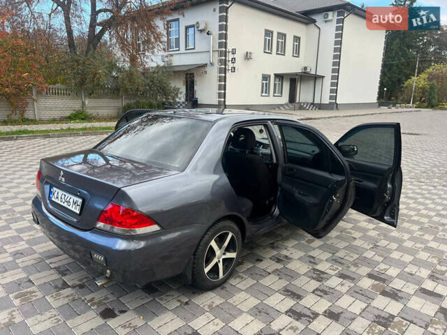 Міцубісі Lancer 2007 у Белой Церкве на Automoto.ua Сірий Міцубісі Lancer, об'ємом двигуна 1.58 л та пробігом 254 тис. км за 3200 $, фото 2 на Automoto.ua