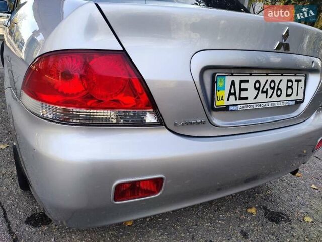 Сірий Міцубісі Lancer, об'ємом двигуна 1.58 л та пробігом 122 тис. км за 6300 $, фото 11 на Automoto.ua