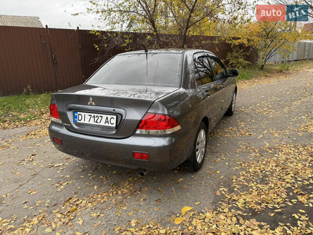 Сірий Міцубісі Lancer, об'ємом двигуна 1.58 л та пробігом 247 тис. км за 4900 $, фото 5 на Automoto.ua