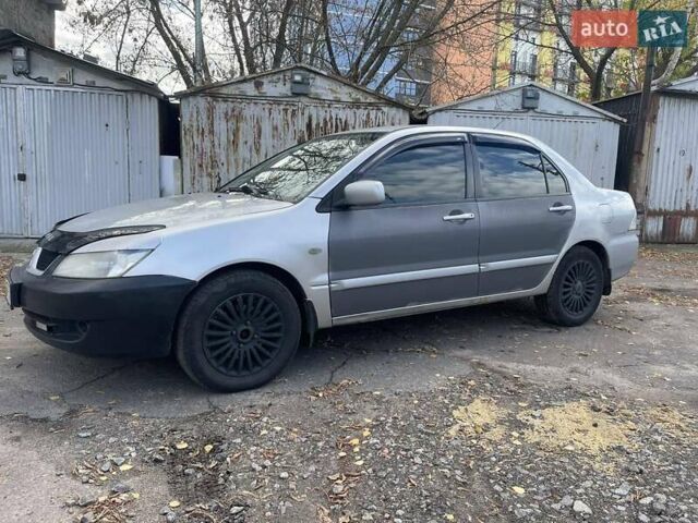Сірий Міцубісі Lancer, об'ємом двигуна 1.58 л та пробігом 305 тис. км за 3300 $, фото 1 на Automoto.ua