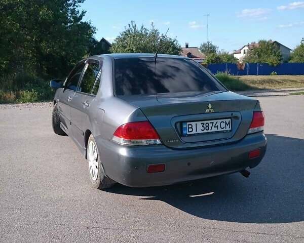 Серый Мицубиси Лансер, объемом двигателя 1.58 л и пробегом 300 тыс. км за 4400 $, фото 5 на Automoto.ua