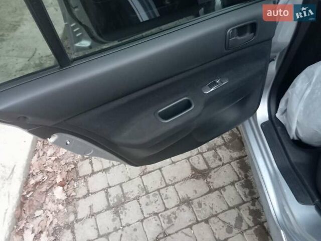 Серый Мицубиси Лансер, объемом двигателя 1.58 л и пробегом 175 тыс. км за 4000 $, фото 3 на Automoto.ua