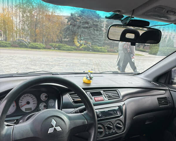 Серый Мицубиси Лансер, объемом двигателя 1.6 л и пробегом 222 тыс. км за 5200 $, фото 14 на Automoto.ua