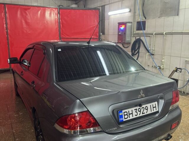 Серый Мицубиси Лансер, объемом двигателя 1.6 л и пробегом 268 тыс. км за 4600 $, фото 3 на Automoto.ua