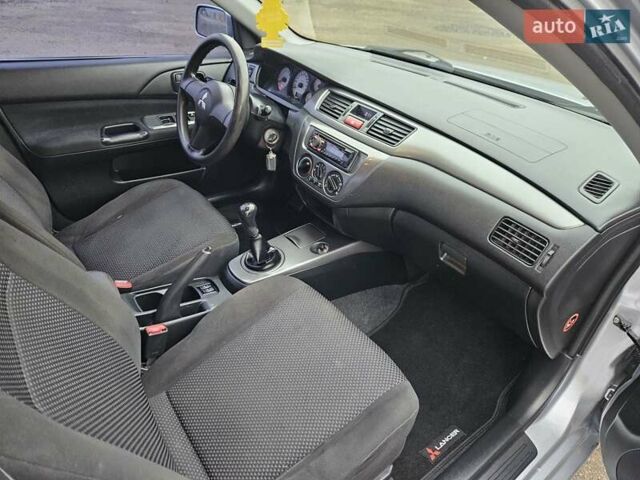 Сірий Міцубісі Lancer, об'ємом двигуна 1.58 л та пробігом 76 тис. км за 4500 $, фото 22 на Automoto.ua