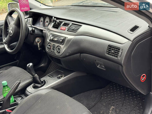 Сірий Міцубісі Lancer, об'ємом двигуна 1.6 л та пробігом 221 тис. км за 3650 $, фото 16 на Automoto.ua