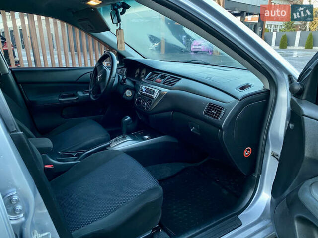 Серый Мицубиси Лансер, объемом двигателя 1.6 л и пробегом 203 тыс. км за 5200 $, фото 5 на Automoto.ua