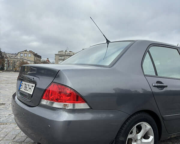 Серый Мицубиси Лансер, объемом двигателя 1.6 л и пробегом 222 тыс. км за 5200 $, фото 9 на Automoto.ua