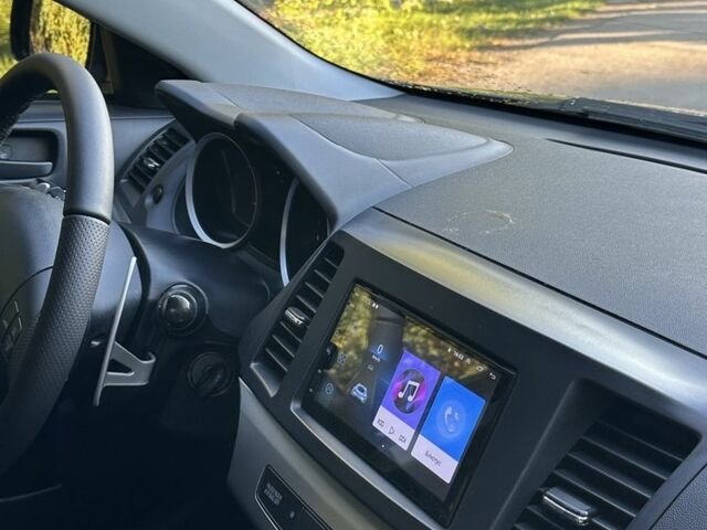 Серый Мицубиси Лансер, объемом двигателя 2 л и пробегом 153 тыс. км за 7500 $, фото 5 на Automoto.ua