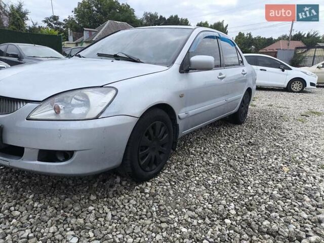 Сірий Міцубісі Lancer, об'ємом двигуна 1.6 л та пробігом 240 тис. км за 2999 $, фото 14 на Automoto.ua