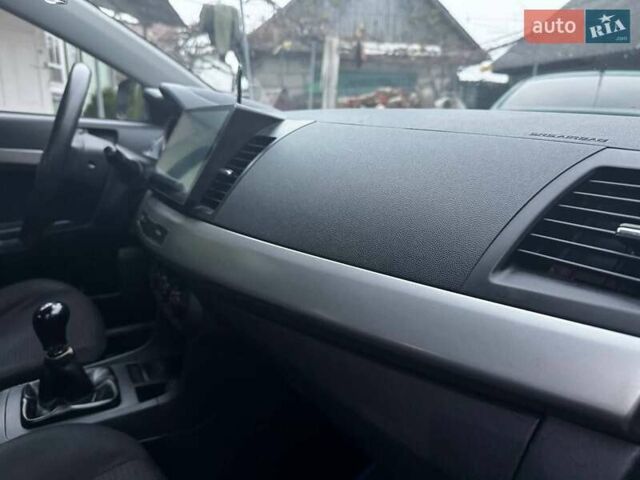 Серый Мицубиси Лансер, объемом двигателя 1.5 л и пробегом 147 тыс. км за 6700 $, фото 18 на Automoto.ua