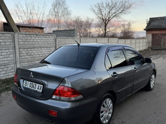 Серый Мицубиси Лансер, объемом двигателя 1.6 л и пробегом 225 тыс. км за 3350 $, фото 3 на Automoto.ua