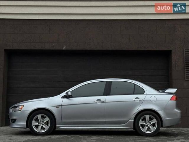 Серый Мицубиси Лансер, объемом двигателя 2 л и пробегом 237 тыс. км за 6899 $, фото 2 на Automoto.ua