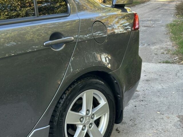 Серый Мицубиси Лансер, объемом двигателя 2 л и пробегом 153 тыс. км за 7500 $, фото 1 на Automoto.ua