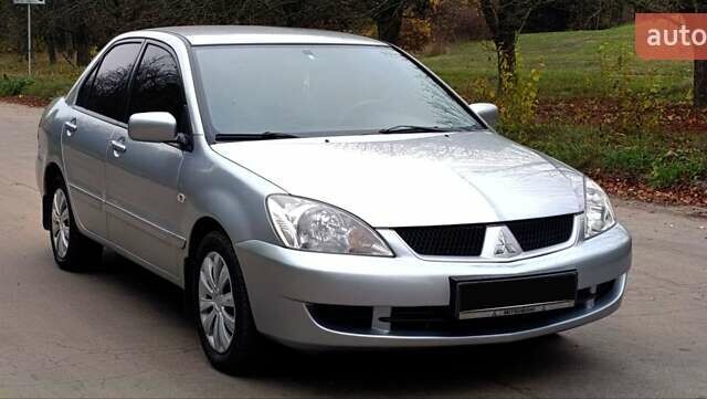 Серый Мицубиси Лансер, объемом двигателя 1.58 л и пробегом 176 тыс. км за 5000 $, фото 3 на Automoto.ua
