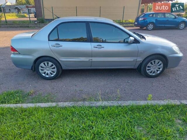 Серый Мицубиси Лансер, объемом двигателя 1.6 л и пробегом 117 тыс. км за 3980 $, фото 9 на Automoto.ua