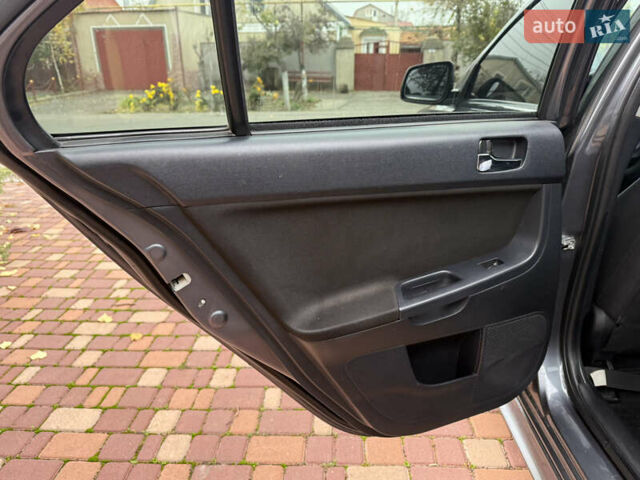 Сірий Міцубісі Lancer, об'ємом двигуна 2 л та пробігом 92 тис. км за 8200 $, фото 26 на Automoto.ua