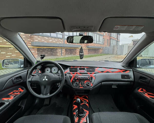 Сірий Міцубісі Lancer, об'ємом двигуна 1.6 л та пробігом 269 тис. км за 3999 $, фото 22 на Automoto.ua