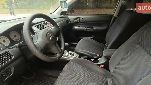 Сірий Міцубісі Lancer, об'ємом двигуна 1.6 л та пробігом 176 тис. км за 4999 $, фото 19 на Automoto.ua