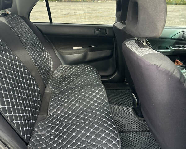 Серый Мицубиси Лансер, объемом двигателя 1.6 л и пробегом 222 тыс. км за 5200 $, фото 16 на Automoto.ua