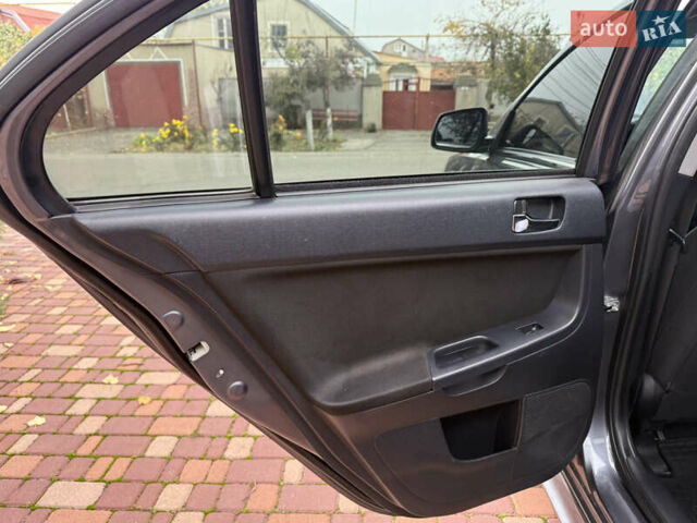 Сірий Міцубісі Lancer, об'ємом двигуна 2 л та пробігом 92 тис. км за 8200 $, фото 27 на Automoto.ua