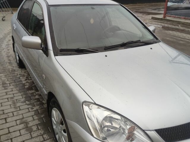 Серый Мицубиси Лансер, объемом двигателя 1.6 л и пробегом 225 тыс. км за 3100 $, фото 1 на Automoto.ua