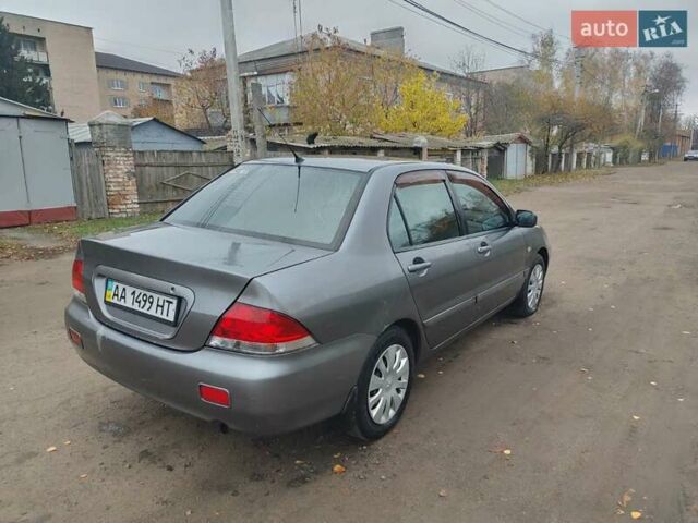 Сірий Міцубісі Lancer, об'ємом двигуна 1.58 л та пробігом 1 тис. км за 2850 $, фото 5 на Automoto.ua