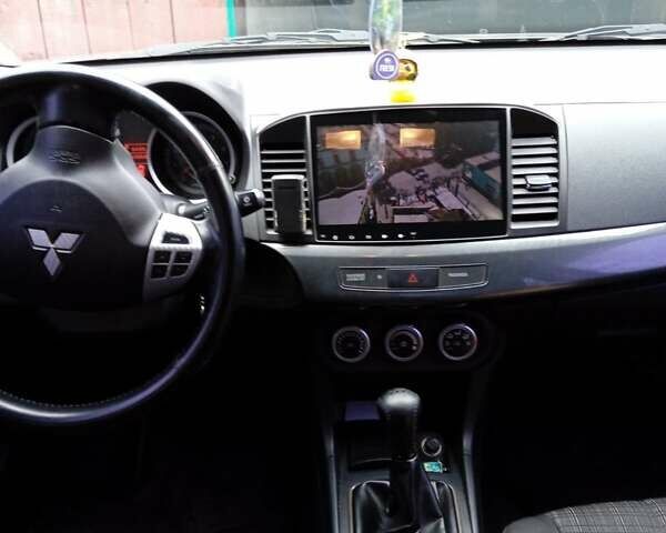 Серый Мицубиси Лансер, объемом двигателя 2 л и пробегом 108 тыс. км за 7500 $, фото 2 на Automoto.ua