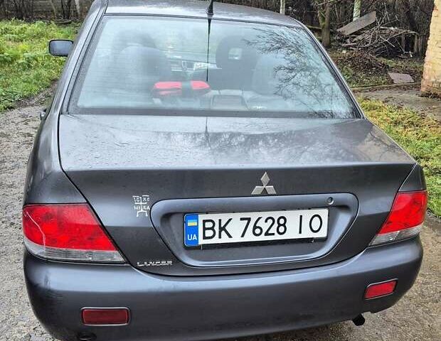 Сірий Міцубісі Lancer, об'ємом двигуна 1.6 л та пробігом 230 тис. км за 4400 $, фото 3 на Automoto.ua