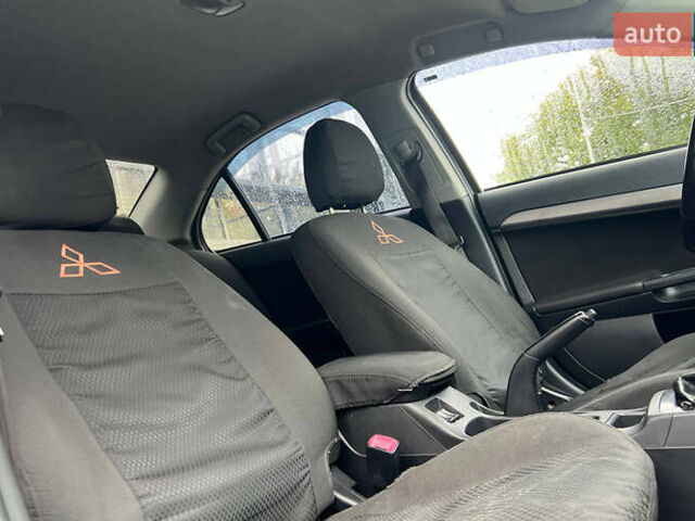 Серый Мицубиси Лансер, объемом двигателя 1.5 л и пробегом 239 тыс. км за 6000 $, фото 16 на Automoto.ua