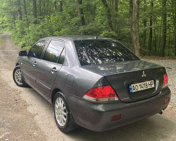 Сірий Міцубісі Lancer, об'ємом двигуна 1.58 л та пробігом 233 тис. км за 4500 $, фото 2 на Automoto.ua