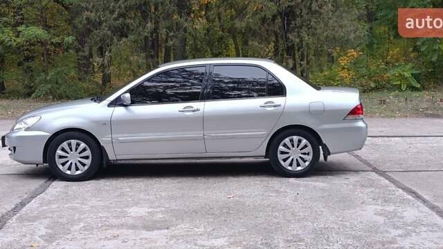 Сірий Міцубісі Lancer, об'ємом двигуна 1.6 л та пробігом 176 тис. км за 4999 $, фото 11 на Automoto.ua