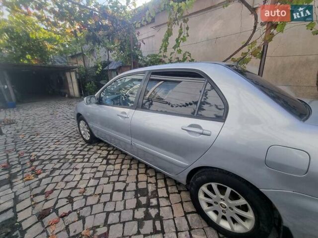 Сірий Міцубісі Lancer, об'ємом двигуна 1.6 л та пробігом 290 тис. км за 3850 $, фото 6 на Automoto.ua