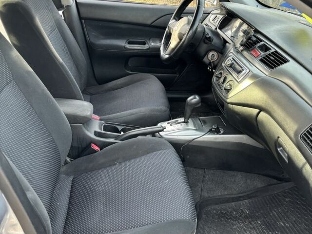 Серый Мицубиси Лансер, объемом двигателя 1.6 л и пробегом 228 тыс. км за 4500 $, фото 5 на Automoto.ua