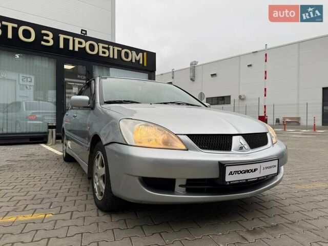 Сірий Міцубісі Lancer, об'ємом двигуна 1.6 л та пробігом 206 тис. км за 4799 $, фото 9 на Automoto.ua
