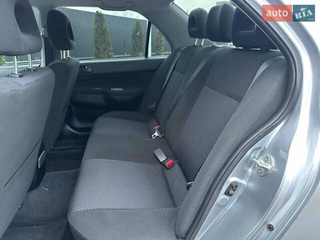 Серый Мицубиси Лансер, объемом двигателя 1.58 л и пробегом 34 тыс. км за 7500 $, фото 25 на Automoto.ua